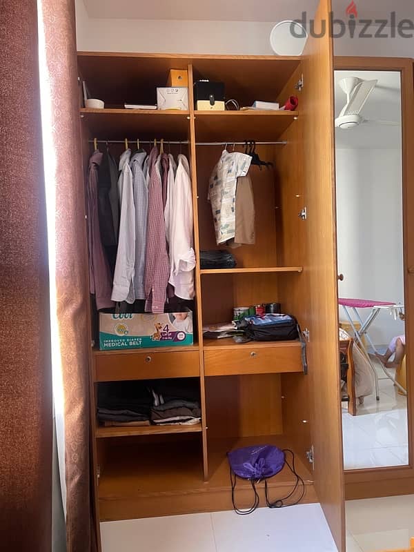 4 door wooden cupboard. good condition 3