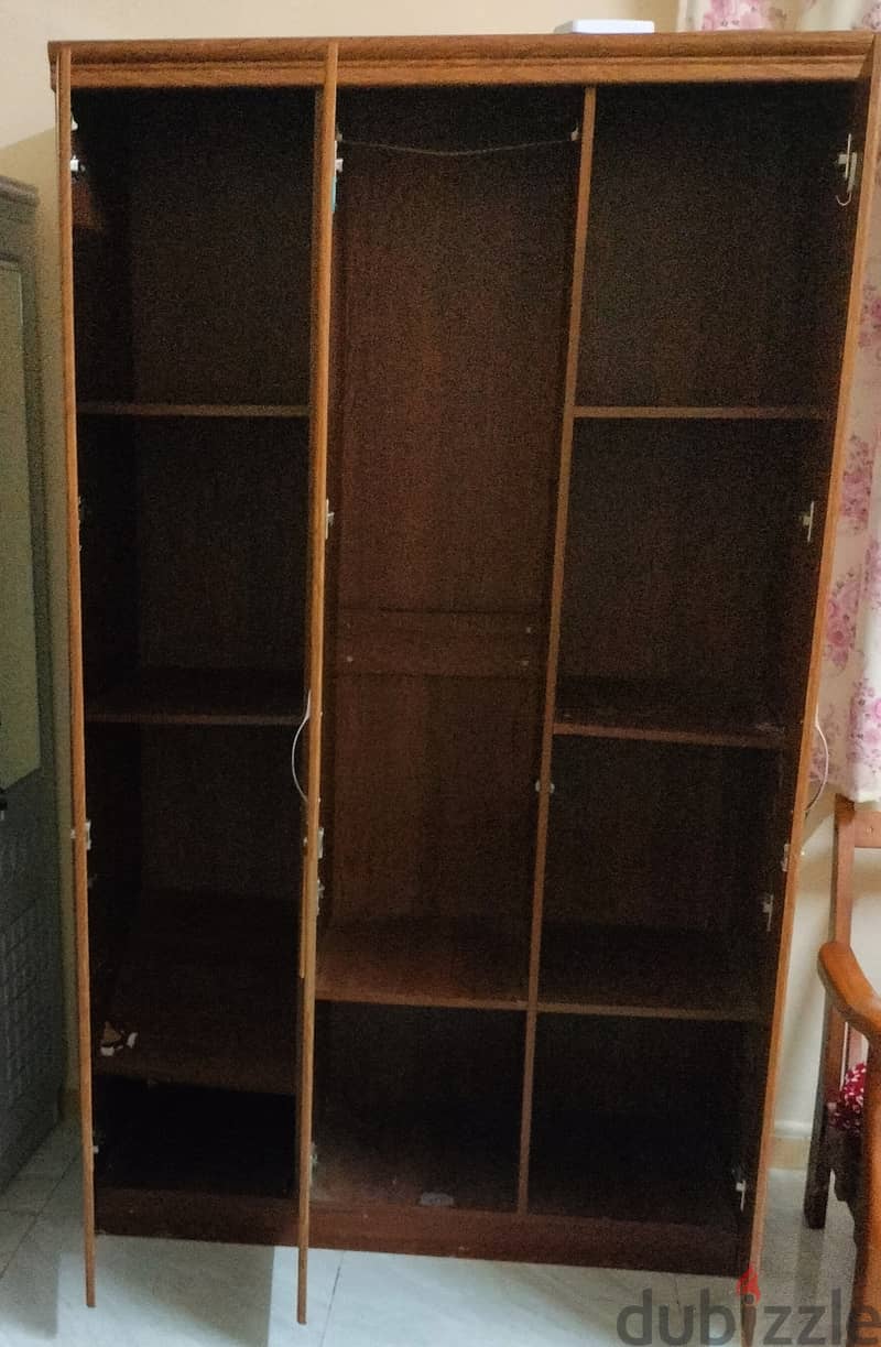 Three door wooden cupboard 1