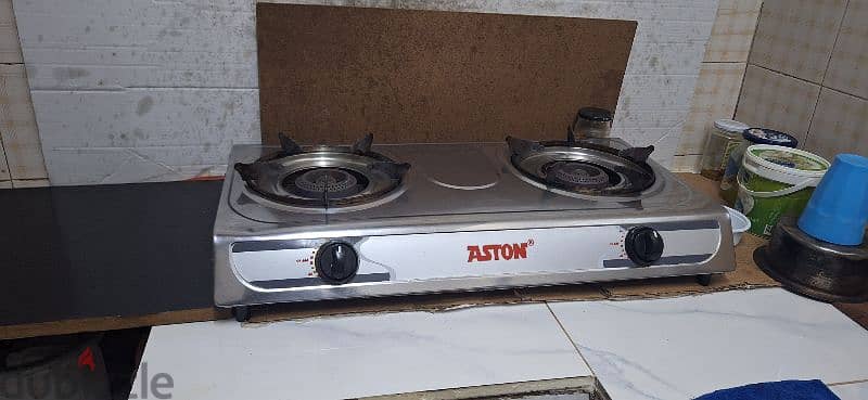 Sell-Stove and Calender. full gas loud. . friz medium. . . 40 rial 1