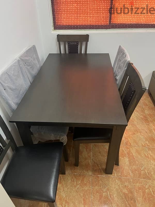 like new rarely used dining table with 6leather chairs 0