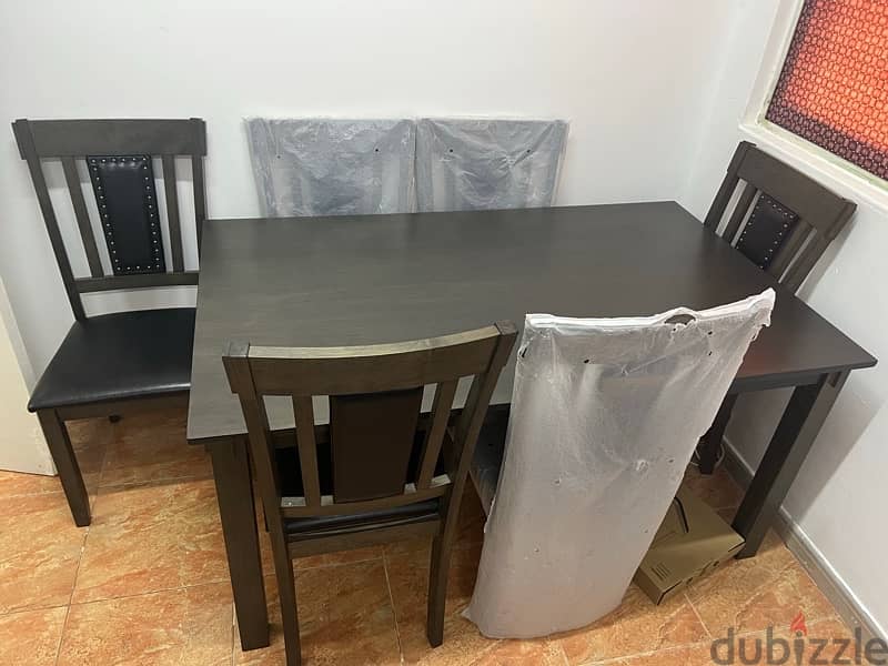 like new rarely used dining table with 6leather chairs 1