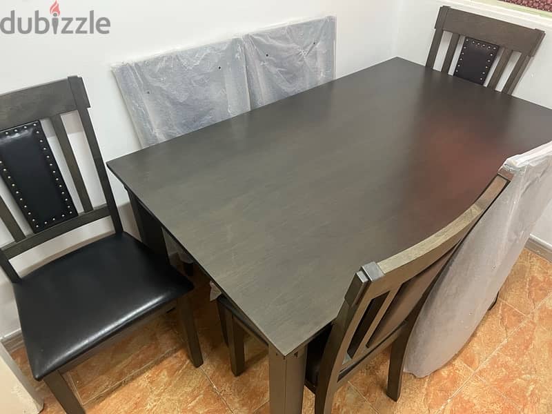 like new rarely used dining table with 6leather chairs 2