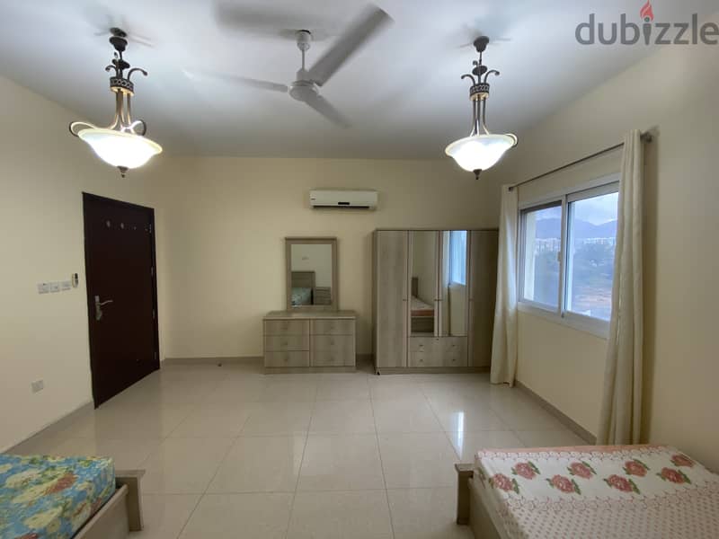 Spacious Fully Furnished room with private washroom in Al Ghubra 4