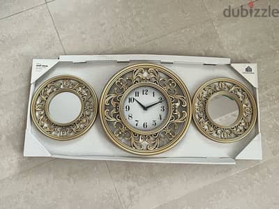 Brand new golden wall clock and mirror