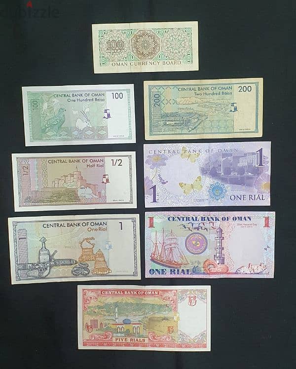 A set of 10 Omani banknotes + 2 coins including Silver Saidi 1