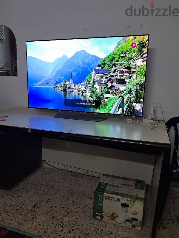 OLED 55 inch smart for sale magic remote with buying price 839 omr. 4