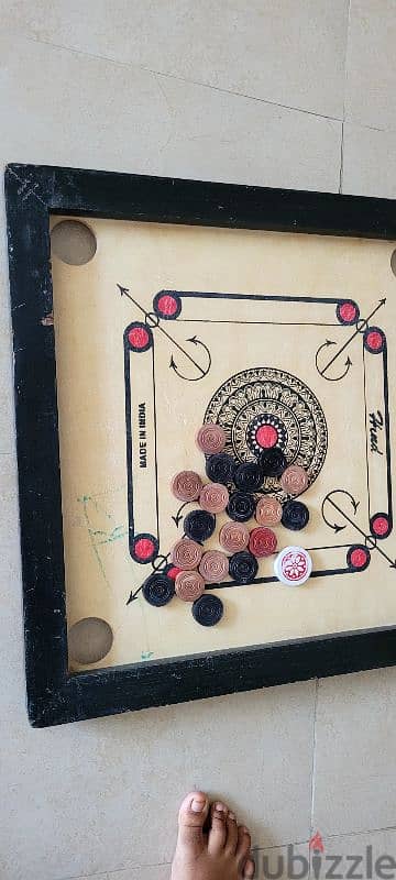 Caroom board with brand new coins 0