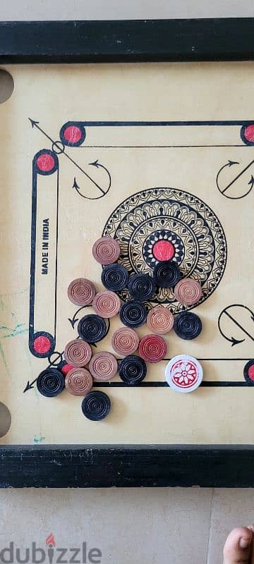 Caroom board with brand new coins 2