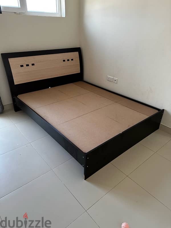 Queen size bed and a covered book shelf on sale 1