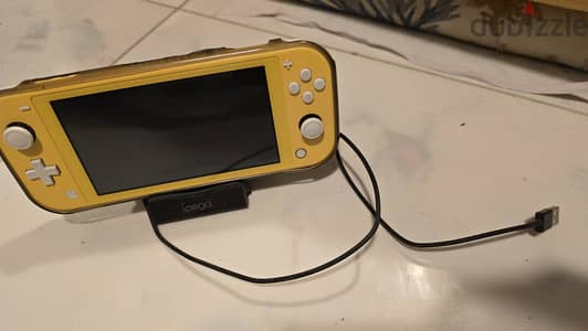 Nintendo Switch Lite with Charger Wire and Holder