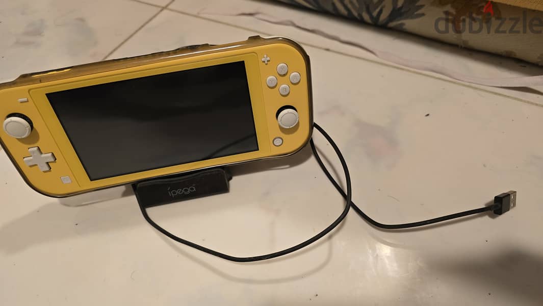 Nintendo Switch Lite with Charger Wire and Holder 0