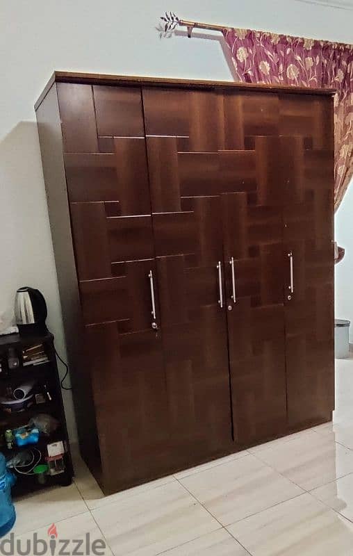 Four door wooden cupboard 0