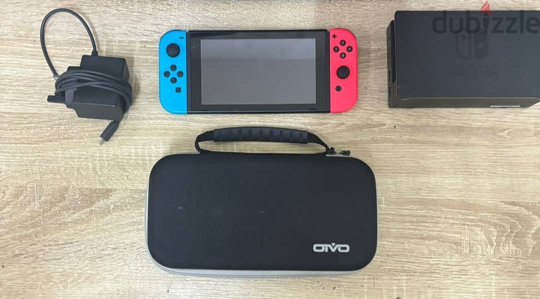 Used nintendo switch, comes with all accesories, carry bag, and game 1