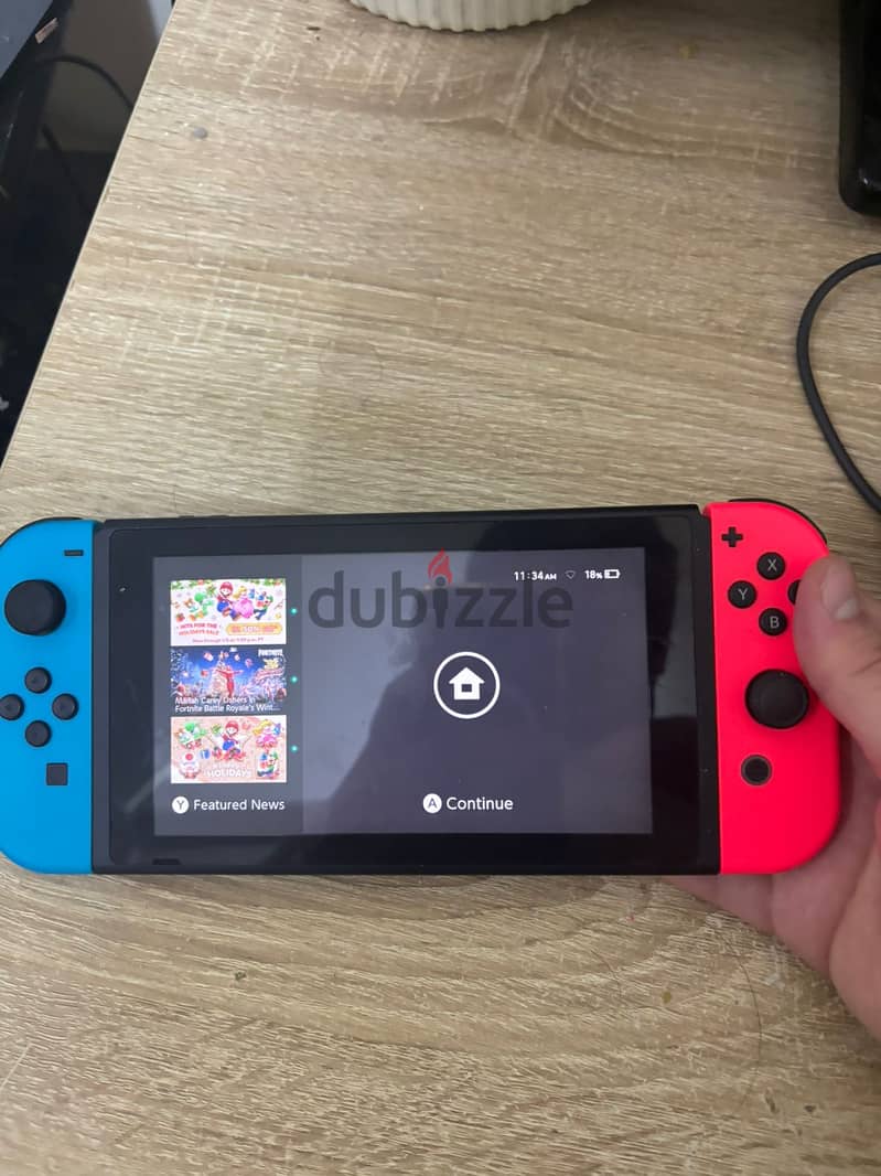 Used nintendo switch, comes with all accesories, carry bag, and game 2