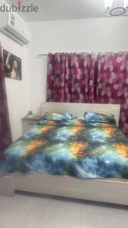 Bed with one side table and mattress. 1