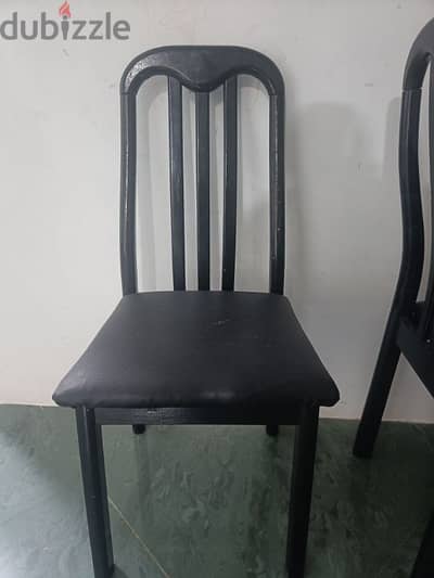 2 Wooden Chairs and dining Table,selling as leaving oman