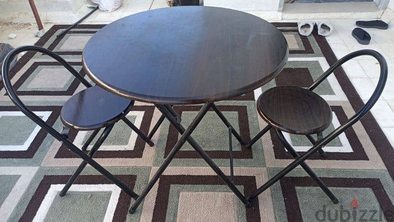 Round tea table with two chairs 0