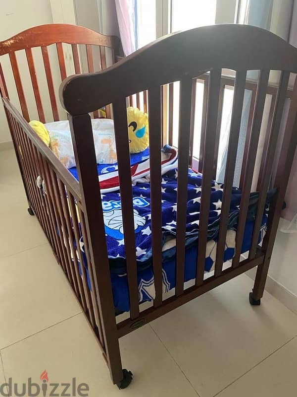 Baby bed in good condition solid wood 0