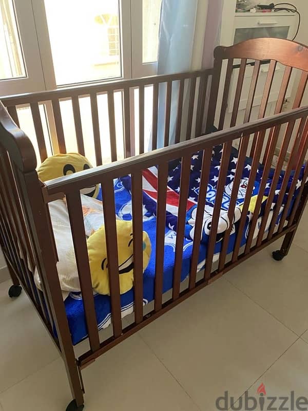 Baby bed in good condition solid wood 1