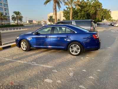 Expat Lady driven Ford Taurus 2013 Blue Sedan