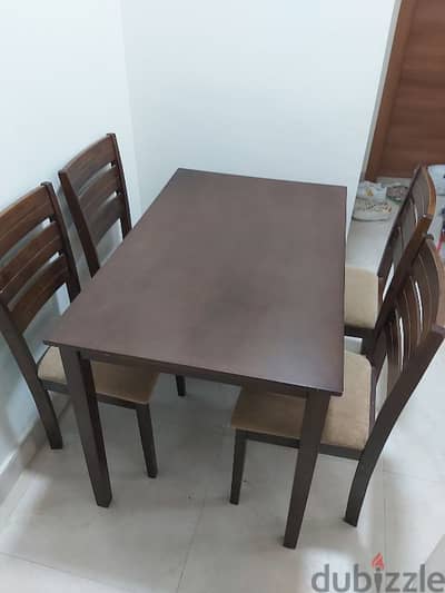 Dining table with 4 chairs ( Almost new )