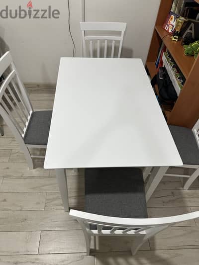 Dining table with 4 chairs very new  and coffee table