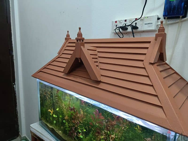 fish aquarium with wooden roof 6