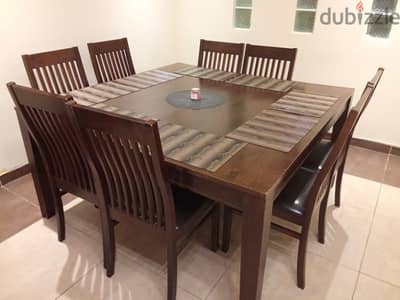 wooden dining table with chairs