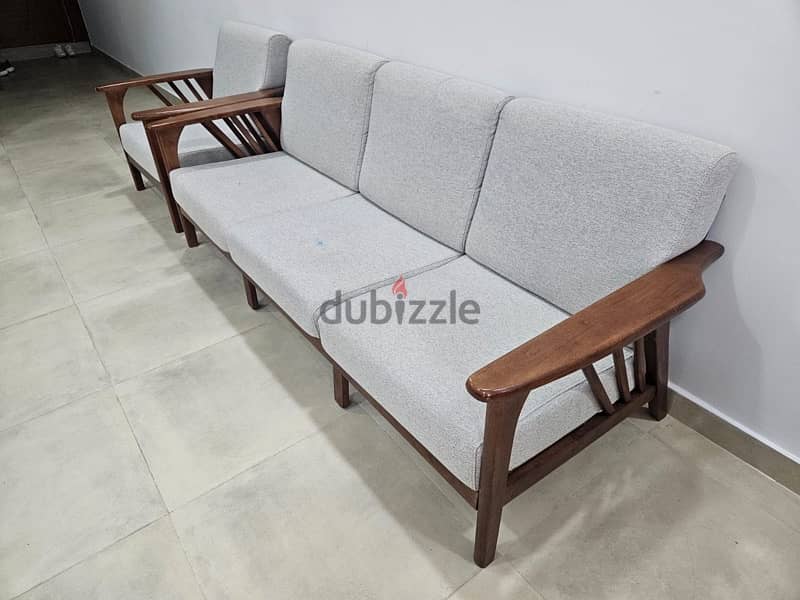 Four sofas with a table 0