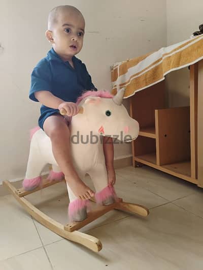 toy. wooden unicorn swing toy