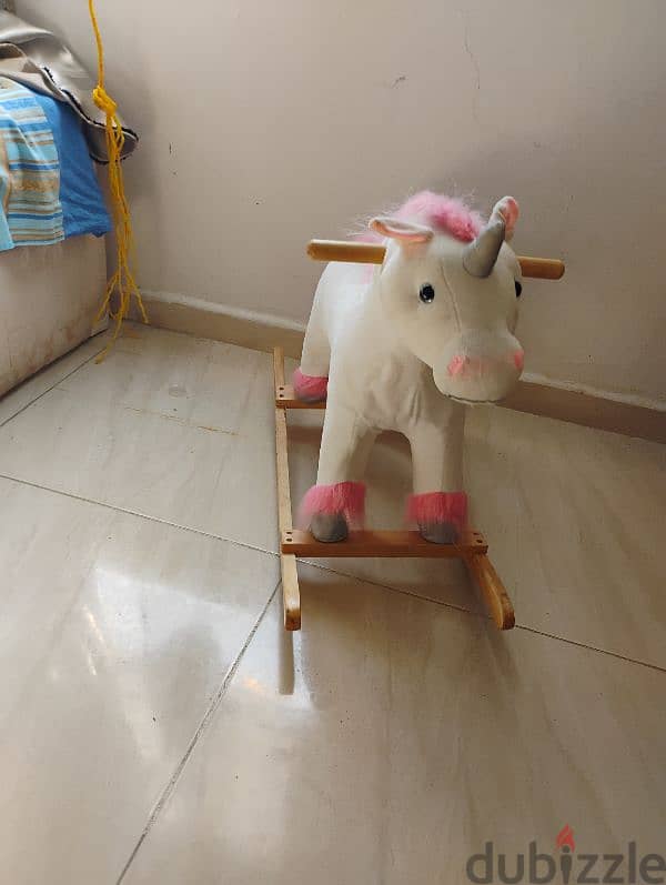 toy. wooden unicorn swing toy 1