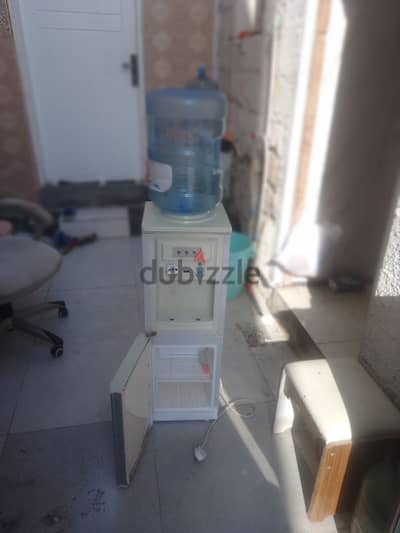 dispenser with cooling cabinet and empty bottle