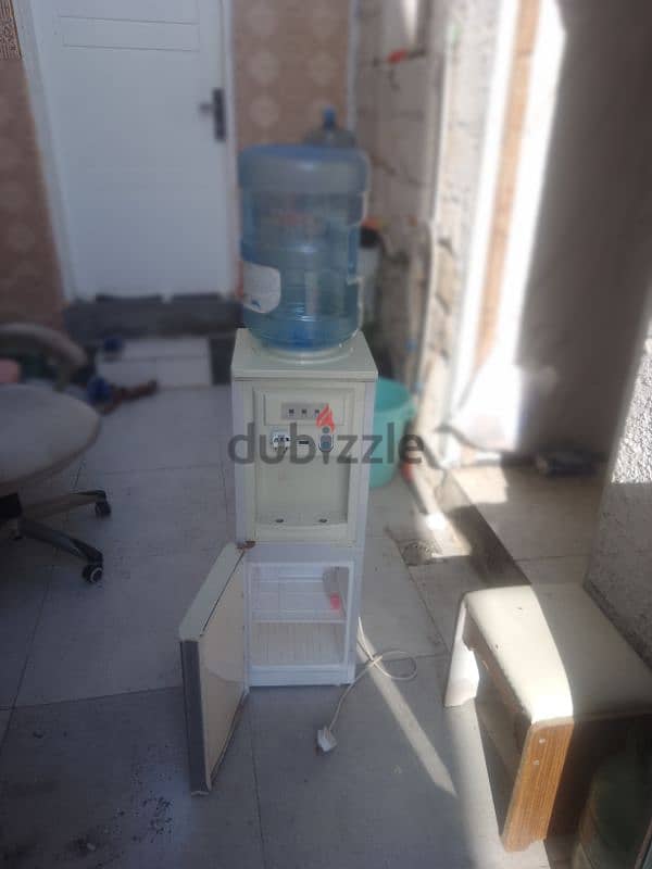 dispenser with cooling cabinet and empty bottle 0