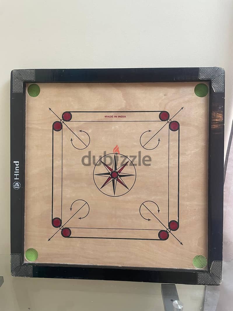 Carrom board with coins 0