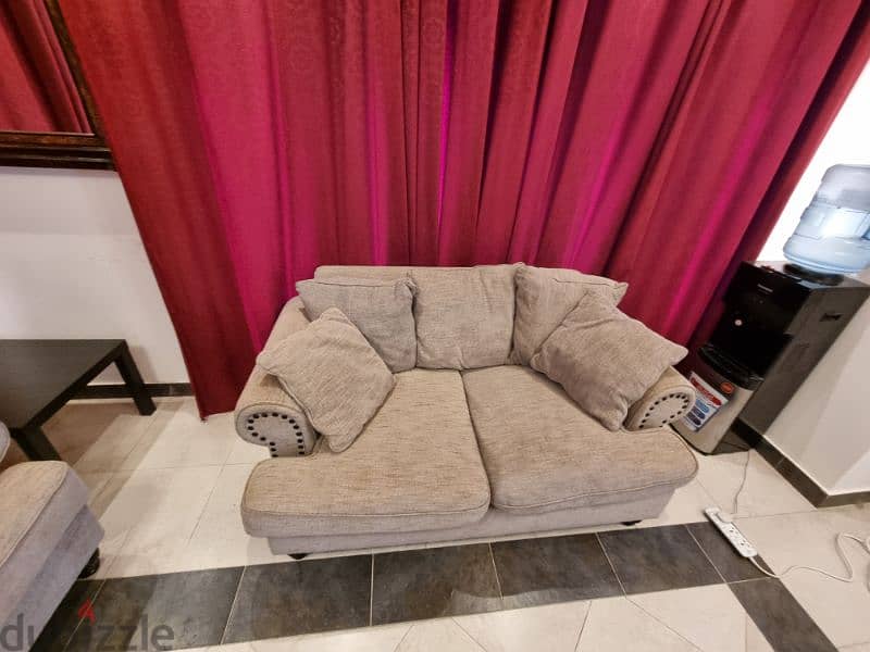 Grey three seater + two seater sofa + rug + center table 4