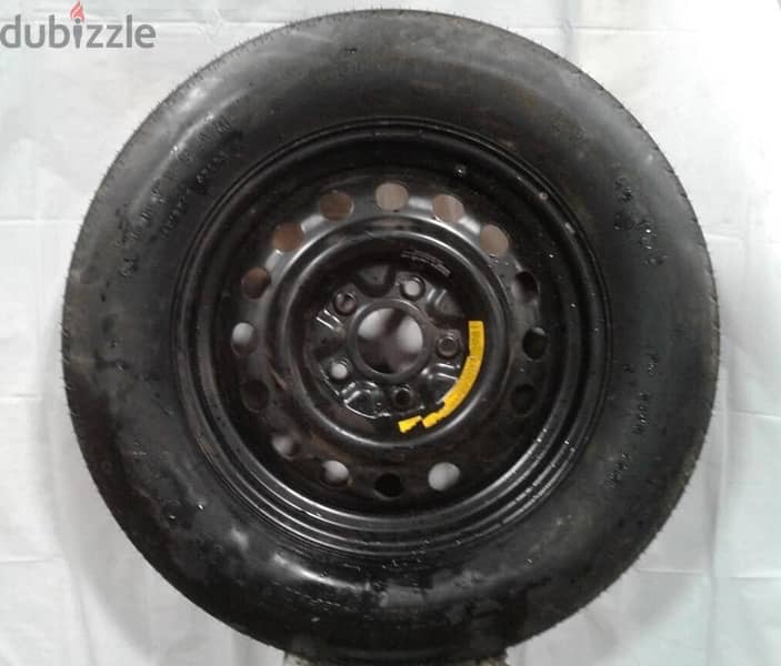 jeep cheroke original spare tire and wheel 1