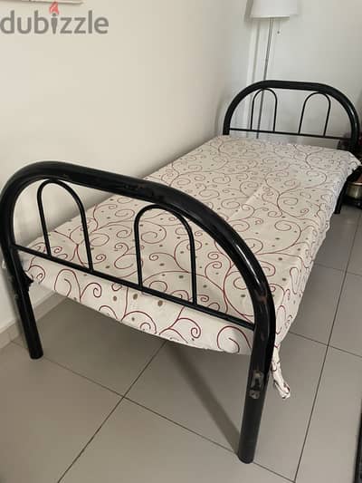 Wrought iron bed  with mattress in good condition