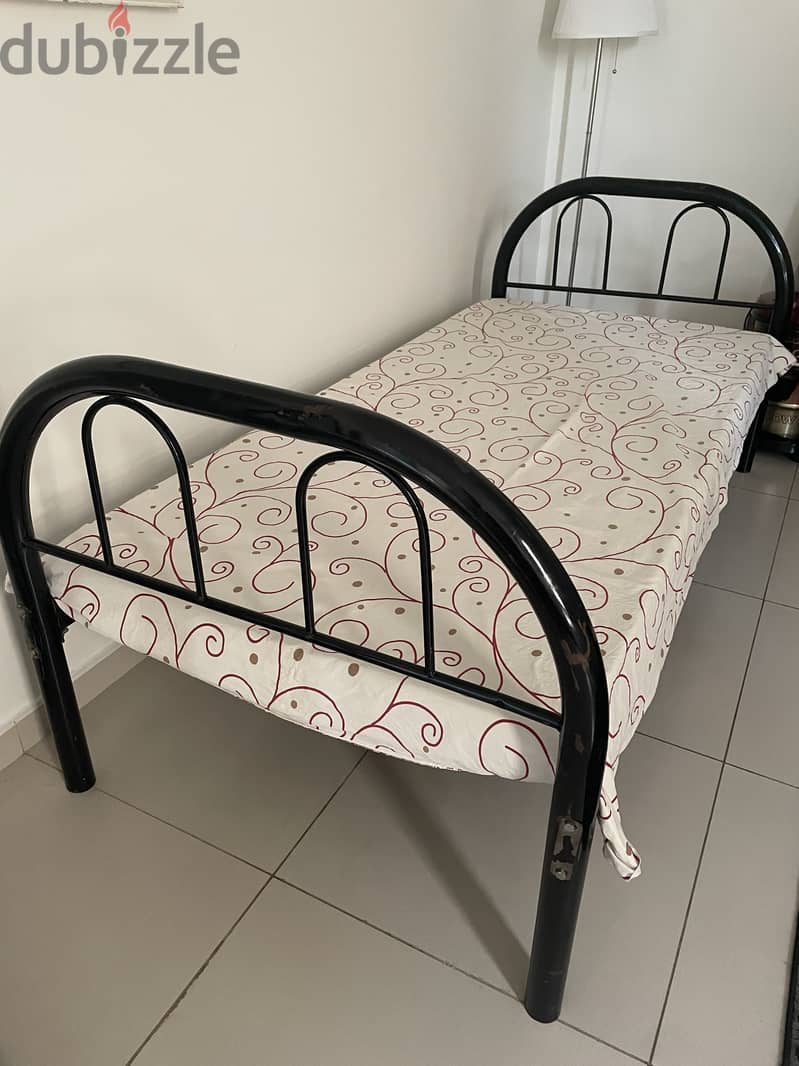 Wrought iron bed  with mattress in good condition 0