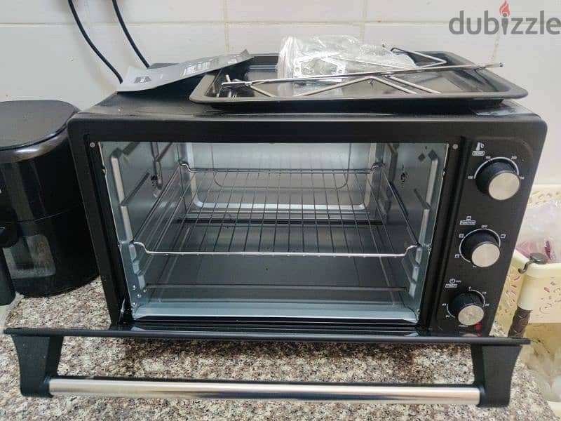 OTG oven with little body dent brand new 2