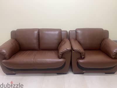 7 seater leather sofas and 2 wooden tables