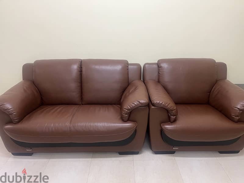 7 seater leather sofas and 2 wooden tables 0