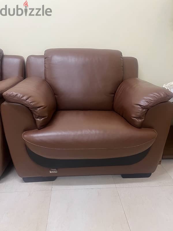 7 seater leather sofas and 2 wooden tables 3