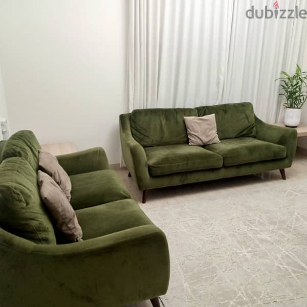 Neat and clean green sofa for sale 1