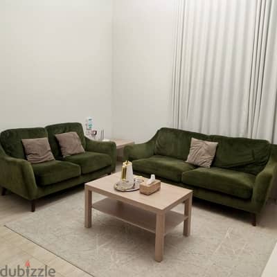 Neat and clean green sofa for sale