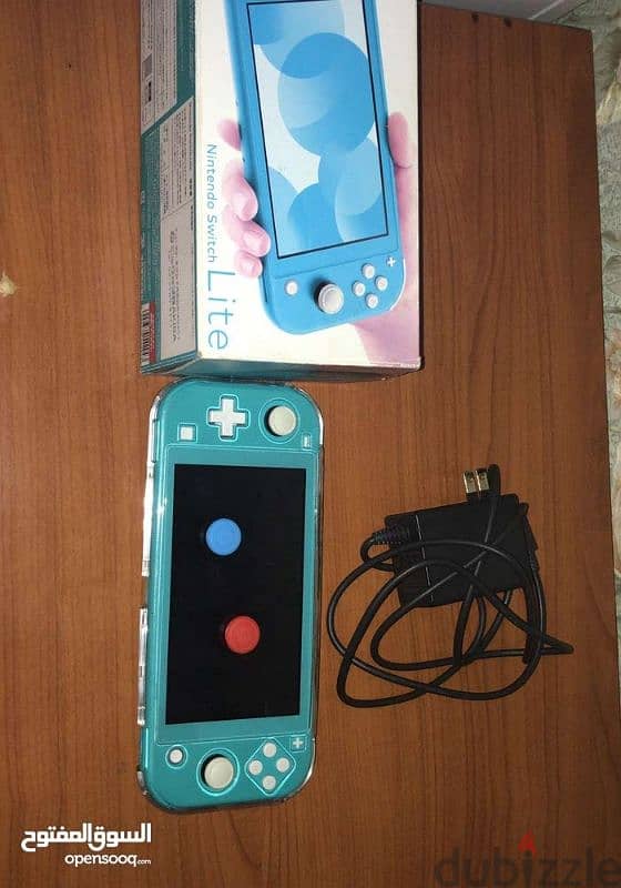 Nintendo switch lite ocean  blue with box and original charger and 0