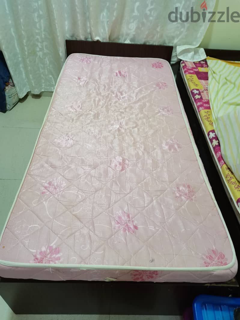 Used single wooden bed with medical mattress 0