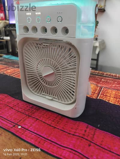 Mini fan with mist spray.