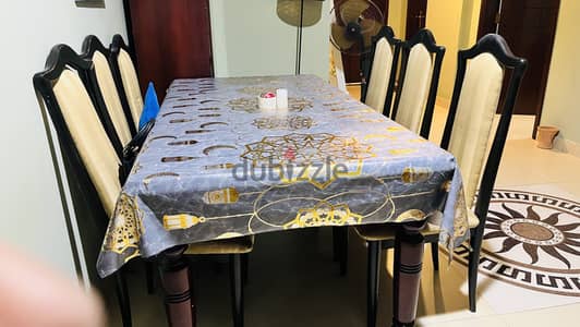 Wooden dining table with 6 chairs for sale