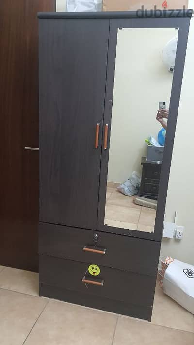 double door wardrobe with mirror and single cot