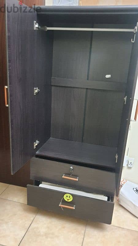 double door wardrobe with mirror and single cot 1